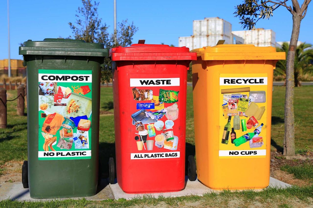 3 trashcans for different hazardous materials